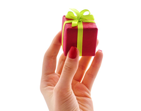 Hand with gift isolated on a white background.の写真素材