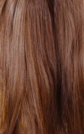 Brown uncombed long hair forming the background.の写真素材