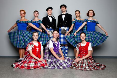Group of dancers of the Scottish dance in kiltsの写真素材