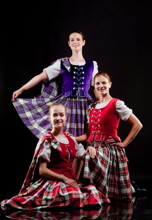 Group of dancers of the Scottish dance in kiltsの写真素材
