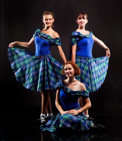 Group of dancers of the Scottish dance in kiltsの写真素材