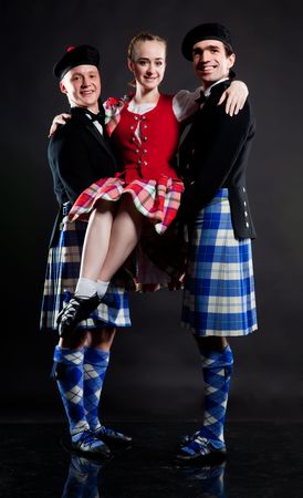 Group of dancers of the Scottish dance in kiltsの写真素材