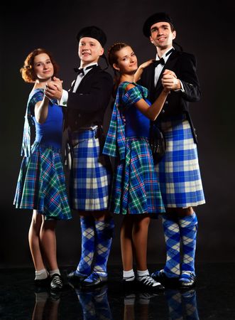 Two pair dancing the Scottish dance in a kiltの写真素材
