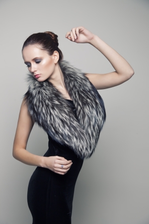 Portrait of the young girl with a fur collarの写真素材