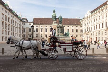 VIENNA, AUSTRIA - OCTOBER 07, 2018: Hofburg Palace and surrounding areas. Monument to Emperor Franz I in the square In der der Burg. Palace building Amalia.のeditorial素材