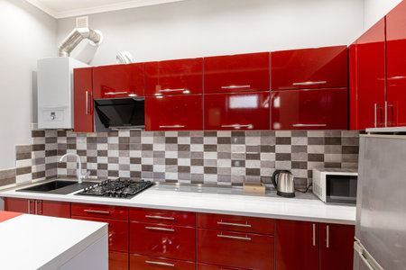 Kitchen interior red, modern loft style, real apartmentの写真素材