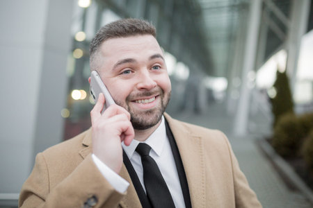 Close up photo, businessman uses phone, portrait of a nice man with beard