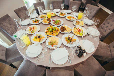 Festive reserved dining table in the restaurantの写真素材
