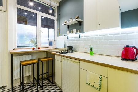 Modern loft style kitchen with yellow interior doorsの写真素材