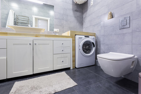 interior photo of a modern bathroom with gray tiles in a small apartmentの写真素材