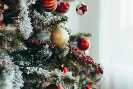 Close-up photo of Christmas decorations on the Christmas tree, multicolored red ballsの写真素材