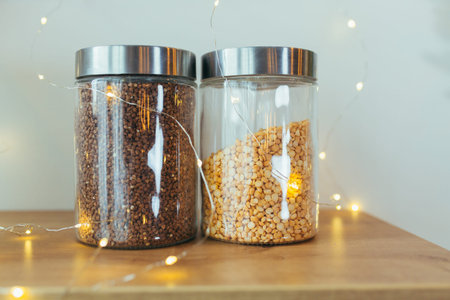 Close-up photo of two jars of cereals in the kitchen