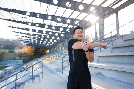 The athlete was injured, the Asian man has a shoulder pain after training and running