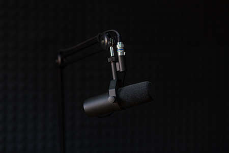 Microphone of recording studio and podcasts, on black backgroundの写真素材
