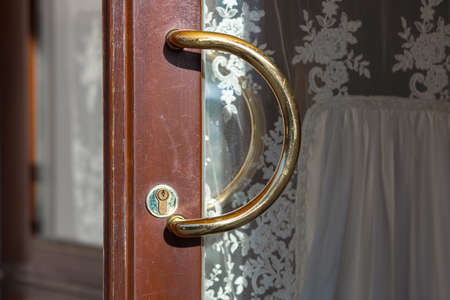 Door handle at the entrance to the restaurant, goldの写真素材