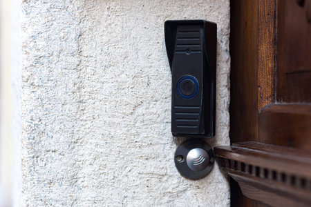 doorbell with remote door opening near the vintage door, in the old part of town
