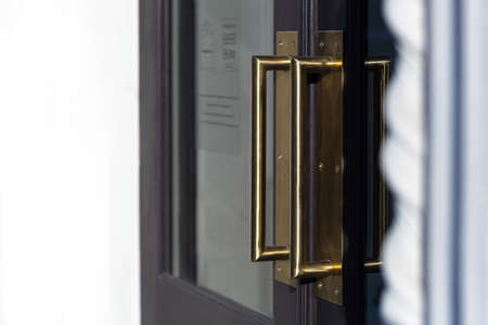 Door handle at the entrance to the restaurant, goldの写真素材