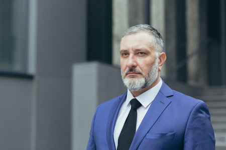 Close-up photo portrait of gray-haired successful businessman boss, man concentrating and thinking...