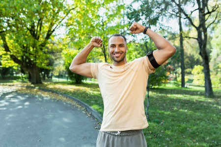 Portrait successful sportsman man satisfied with training results and achievements ,looking at...