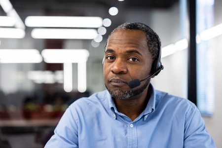 Customer service representative with headset in modern office, offering assistance and support. Focused and ready to help with queries or issues. Ideal image for corporate and professional themes.の写真素材