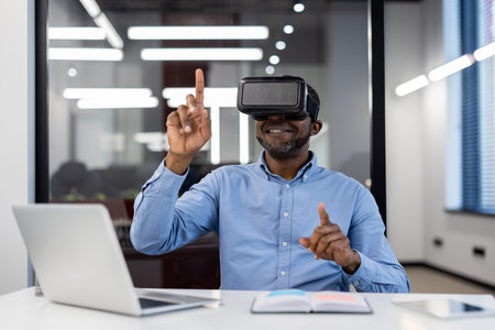 Businessman wearing virtual reality headset engaged with virtual environment using hand gestures....