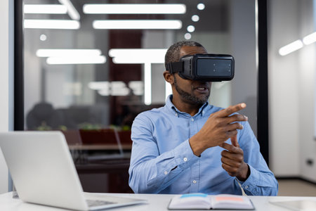 African American mature businessman in office using virtual reality headset for demonstration....