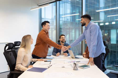 A group of professionals engaged in a collaborative meeting, discussing ideas while fostering...