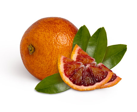 blood red orange with slice and leaves isolated with clipping path, full depth of fieldの写真素材