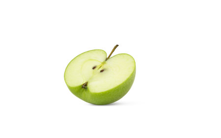 Halved green apple isolated on white background with shadow.の写真素材