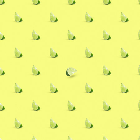 Seamless lime cut pattern on yellow creamy background.の写真素材