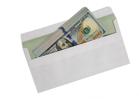 Dollars in a white envelope isolated on white background. 100 bills.の写真素材