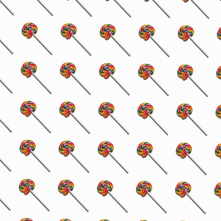 Pattern of colorful lollipops on a white background. Candy concept to change background color. Colorful sweet food.の写真素材