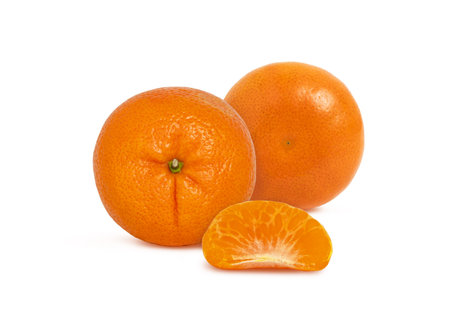 Two tangerines with a slice isolated on white background. Mandarin fruit.の写真素材