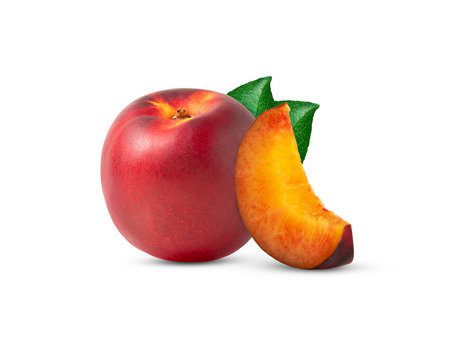 Fresh nectarine peach and cut in a slice with green leaf isolated.の写真素材