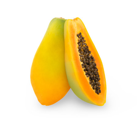 Fresh ripe papaya fruit and a half isolated. Two vertical papayas.の写真素材