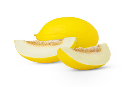 One whole yellow melon and two slices with seeds isolated.の写真素材