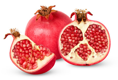 Red ripe pomegranate and cut in a half isolated. Pomegranates fruits with clipping path.の写真素材