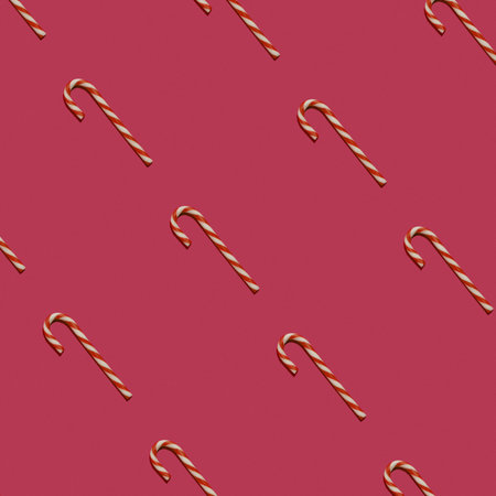 Pattern of red-white candy cane on a pink background. Concept of Christmas. Sweet candy food background.の写真素材