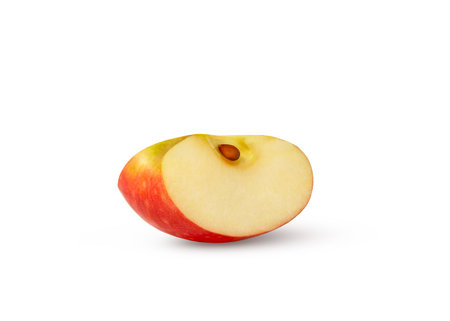 Red apple wedge with seed isolated.の写真素材