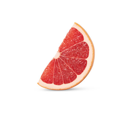 Standing slice of grapefruit isolated. Citrus fruit wedge cut out.の写真素材
