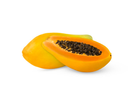 Half of papaya and whole papaya fruit isolated.の写真素材