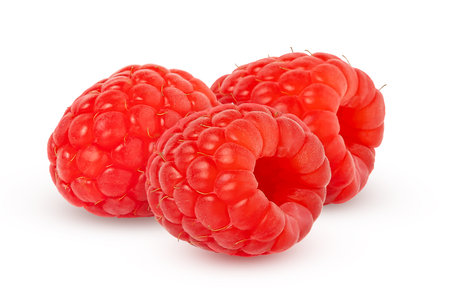 Raspberry isolated. Three red raspberries with clipping path..の写真素材