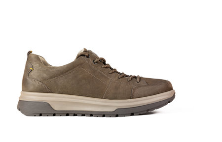 Casual brown leather sneaker isolated on white background. Concept of office or sport shoesの写真素材