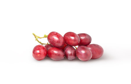 Small red grape cluster isolated. Fresh wine grape with clipping path.の写真素材