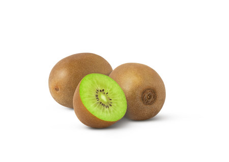 Close-up of whole kiwi fruit and one sliced isolated on white backgroundの写真素材