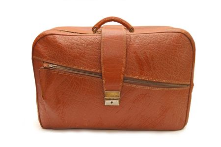 Old brown suitcase on a white backgroundの写真素材