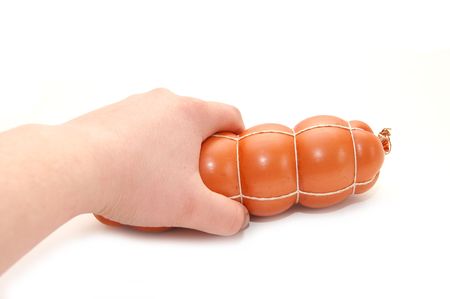 The hand holds sausage on a white backgroundの写真素材