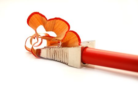 red pencil and sharpener with a shavingの写真素材