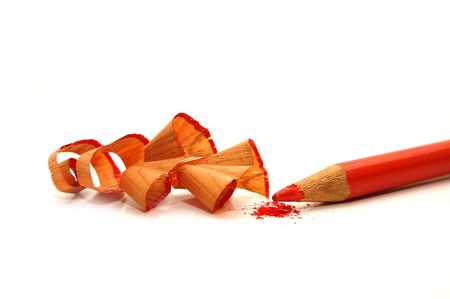 red pencil and sharpener with a shavingの写真素材