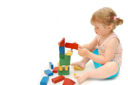 little girl playing with cubesの写真素材